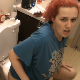 A girl with red dyed hair has diarrhea and/or wet farts while sitting on a toilet in at least 13 different scenes. Presented in 720P HD. Over 5.5 minutes.   